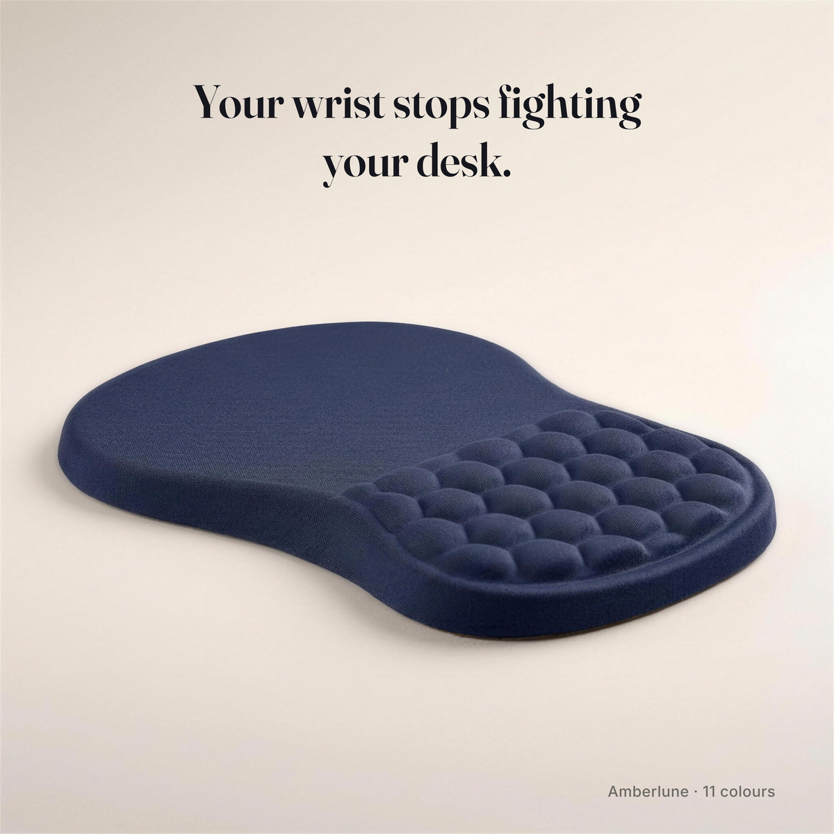 Ergonomic memory foam mouse pad with raised wrist rest, dark blue